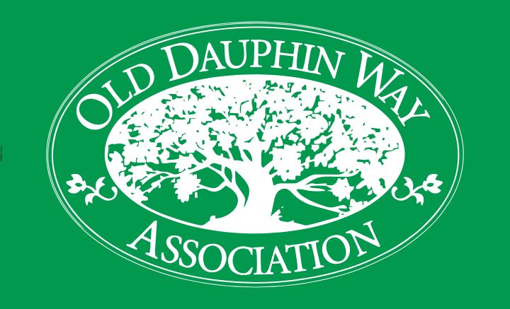 Green Old Dauphin Way Association flag with white live oak emblem